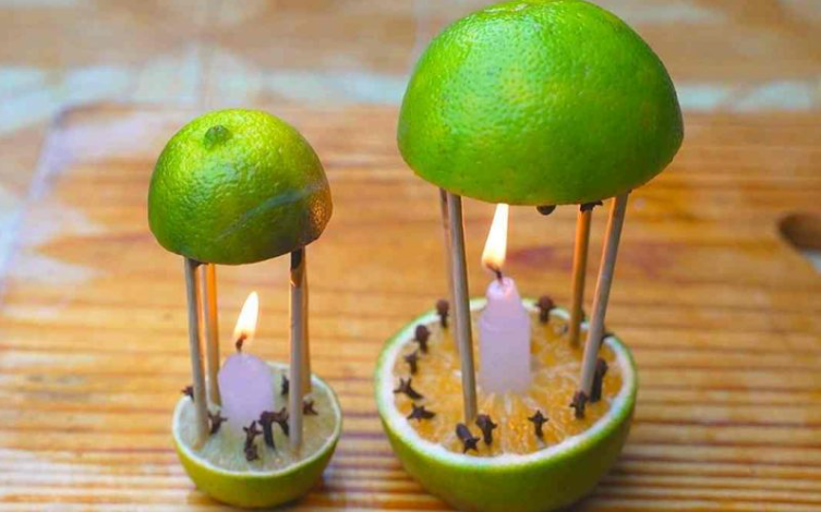 Éloignez les moustiques et parfumez votre maison : l'astuce naturelle aux citrons, clous de girofle et bougies